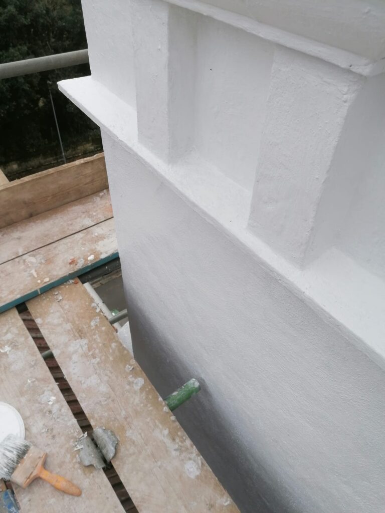 Freshly rendered parapet wall