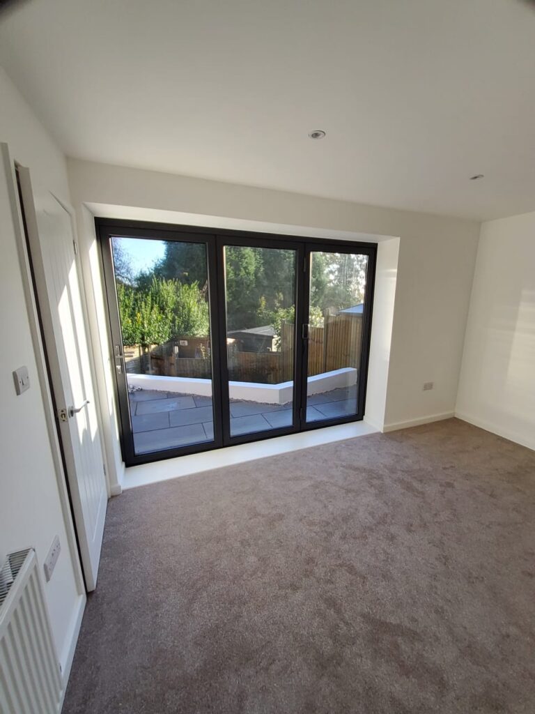 Living room renovation with patio doors