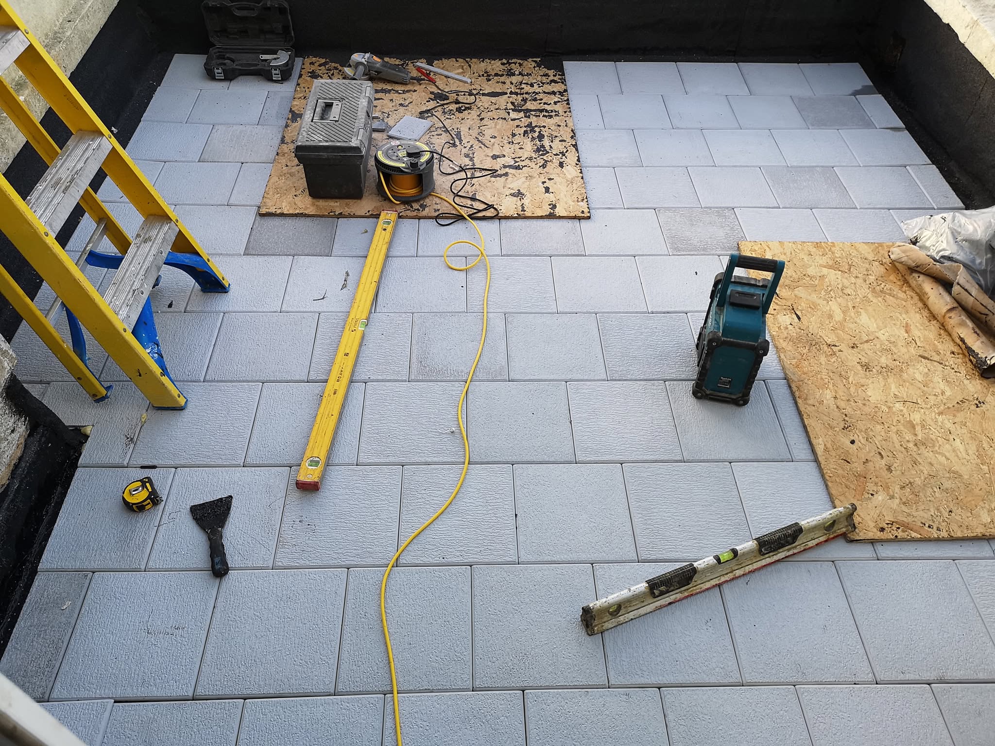 Roof repair and tiling in progress